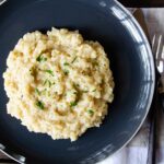 Parmesan Risotto on a grey plate.