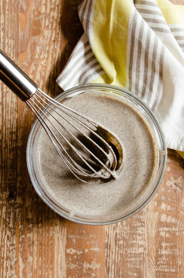 Buckwheat crêpe batter in a bowl with whisk.