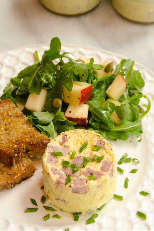 Instant Egg Bite with toast and salad on a white plate