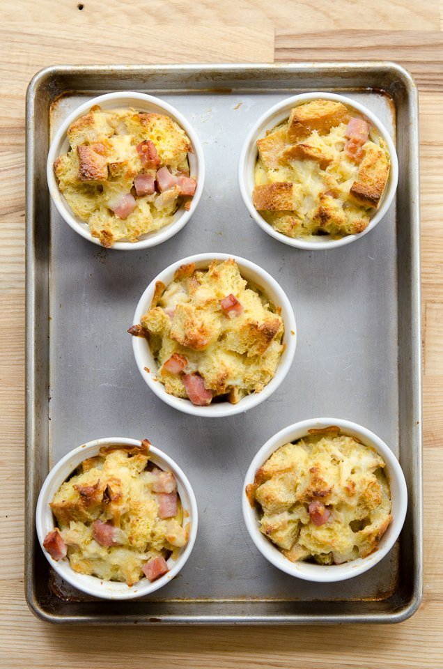 5 cooked monte cristo bread puddings on a sheet pan.