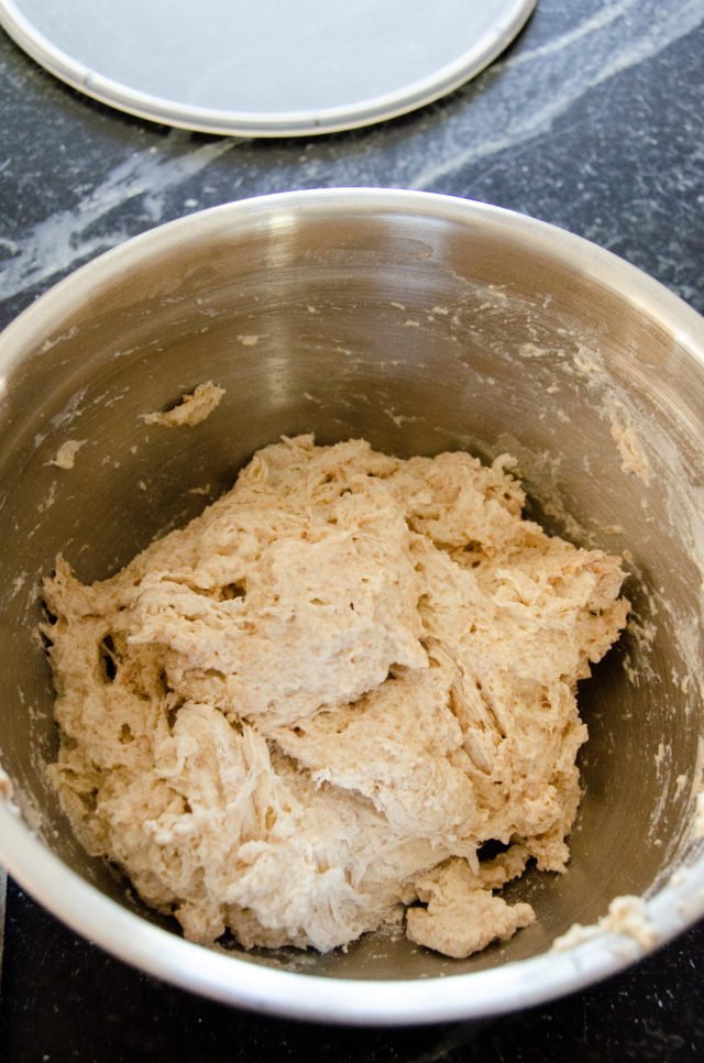 Whole wheat no knead bread ingredients mixed together.