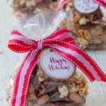 Cajun Spiced Snack Mix in telephone bags with red and white ribbons.