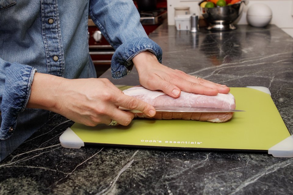 Showing how to double-butterfly a pork loin.
