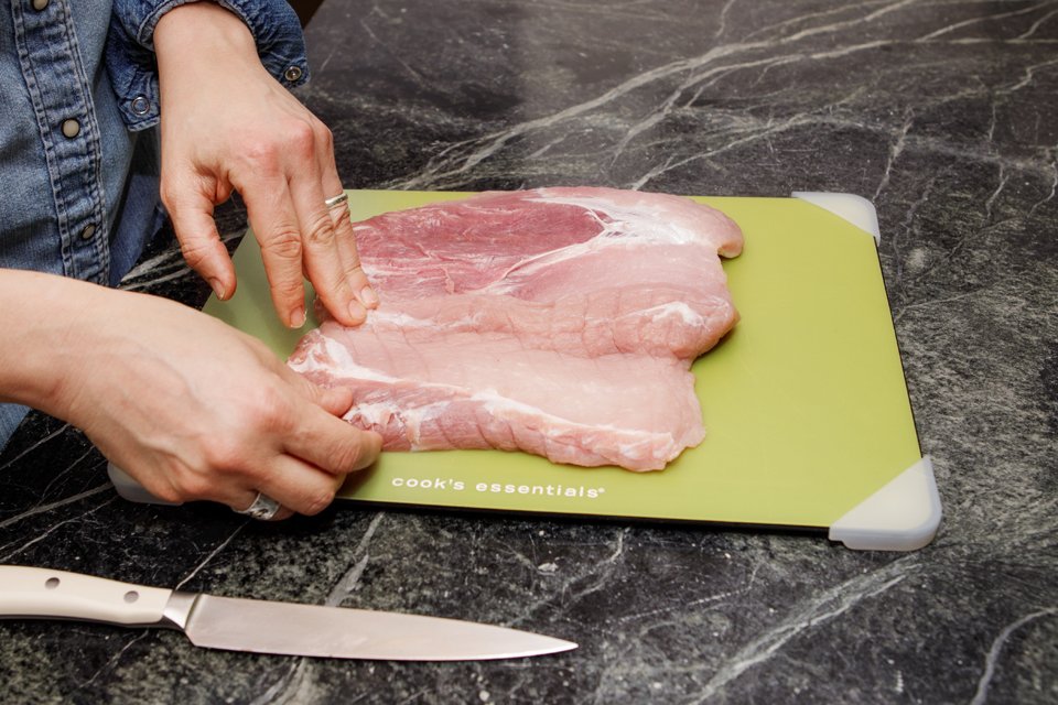 Showing how to double-butterfly a pork loin.