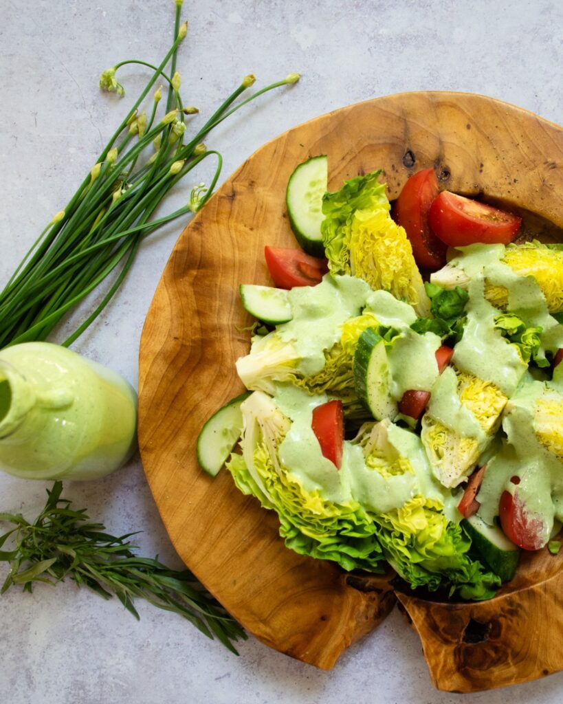 Green Goddess Dressing poured over little Bibb lettuces and tomatoes.