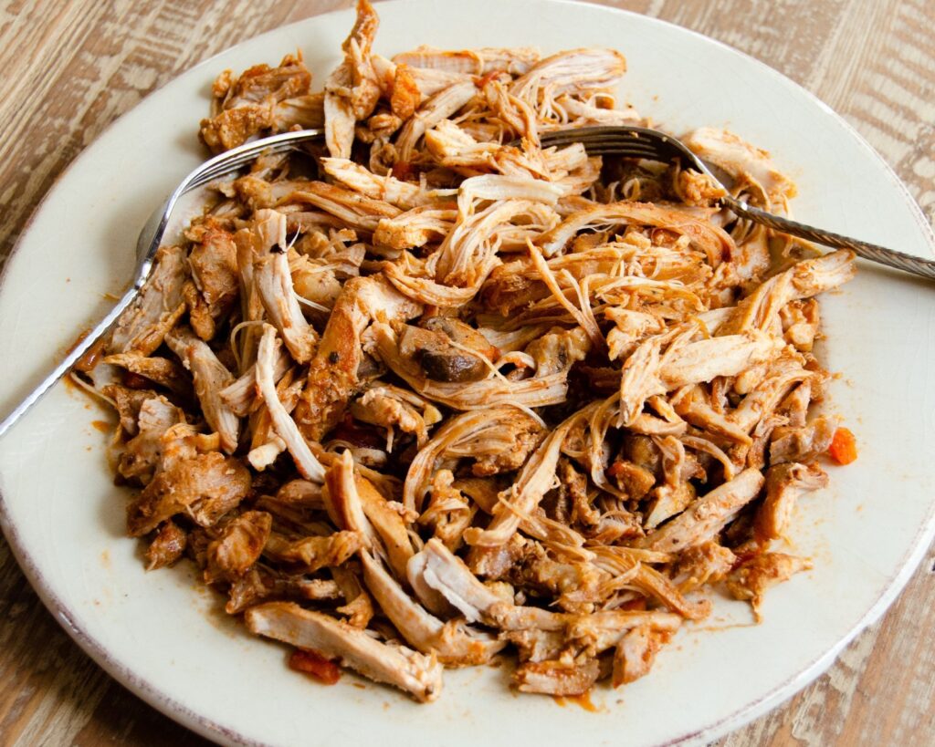 Shredded chicken on a plate.