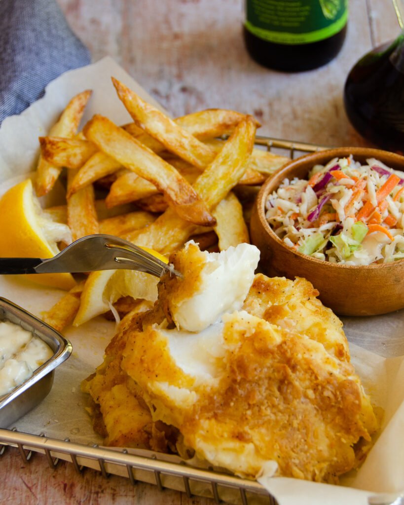 Traditional Homemade British Beer Battered Fish and Chips, with a classic  easy batter recipe