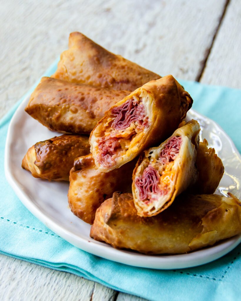 https://bluejeanchef.com/uploads/2020/02/Reuben-Egg-Rolls-1280-453-819x1024.jpg