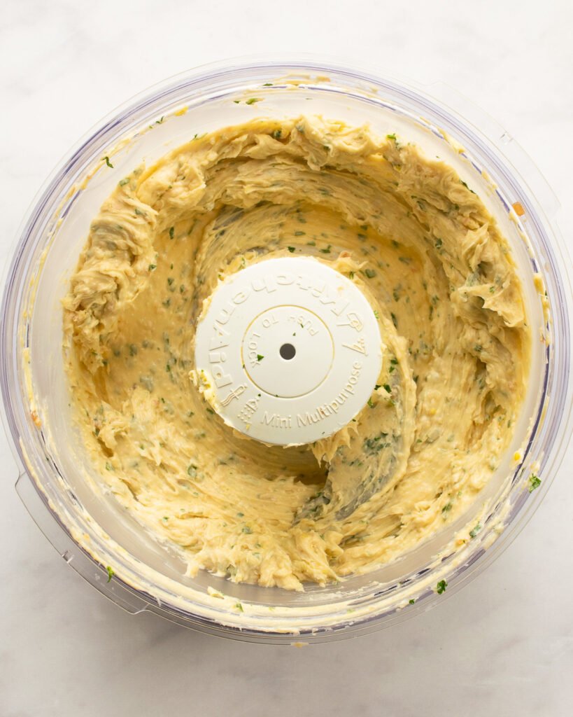Gorgonzola shallot butter in a food processor bowl.