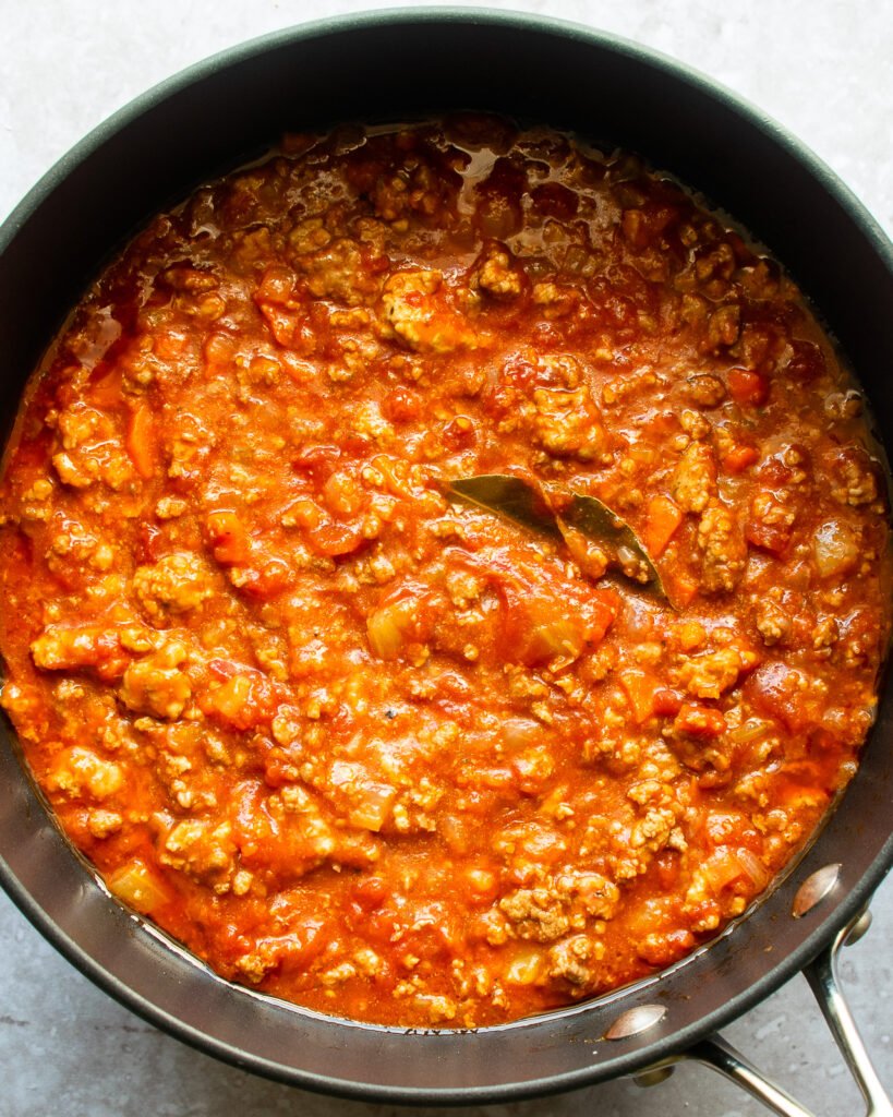 A saute pan of bolognese sauce.