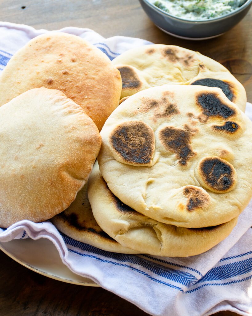 https://bluejeanchef.com/uploads/2021/03/Pita-Bread-1280-3369-819x1024.jpg