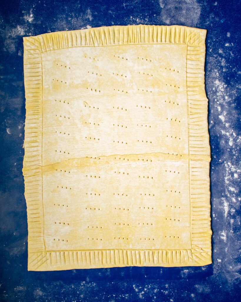 Puff pastry, scored around the perimeter and docked.