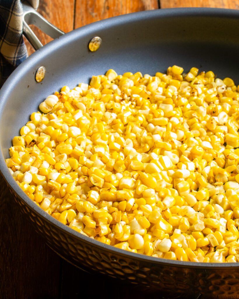 Corn kernels in a skillet.