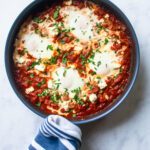 Looking straight down into a skillet with shakshuka in it.