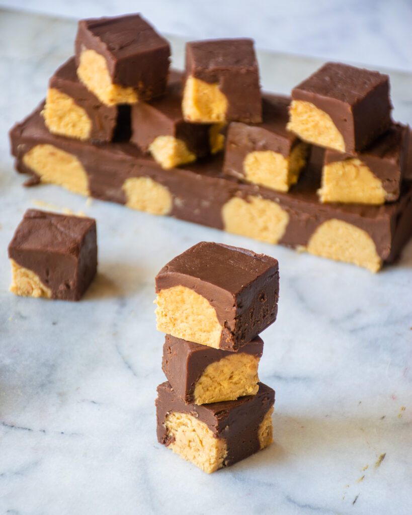 A stack of buckeye fudge on a marble board.