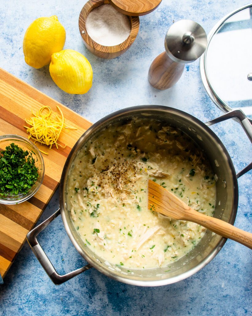 Looking down into a pot of Avglolemono soup.