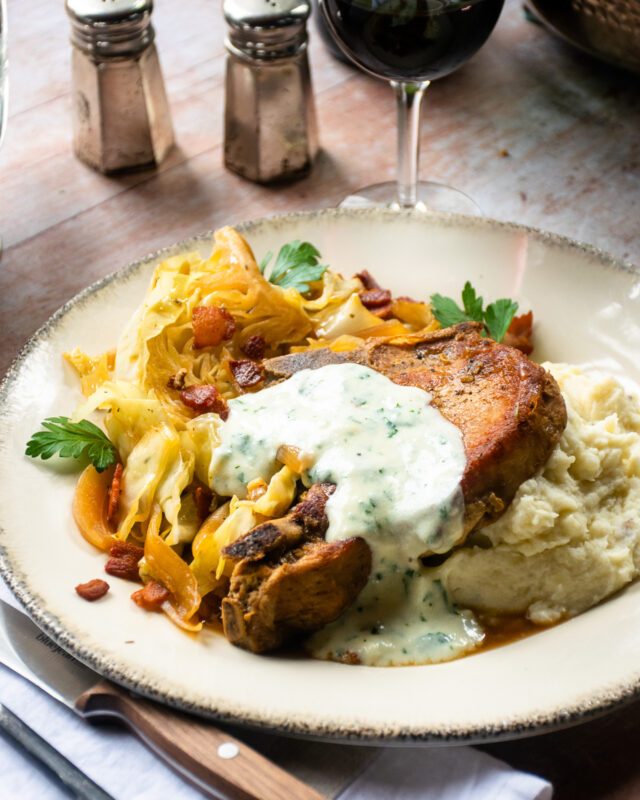 Braised Pork Chops with Cabbage, Bacon and Parsley Sauce