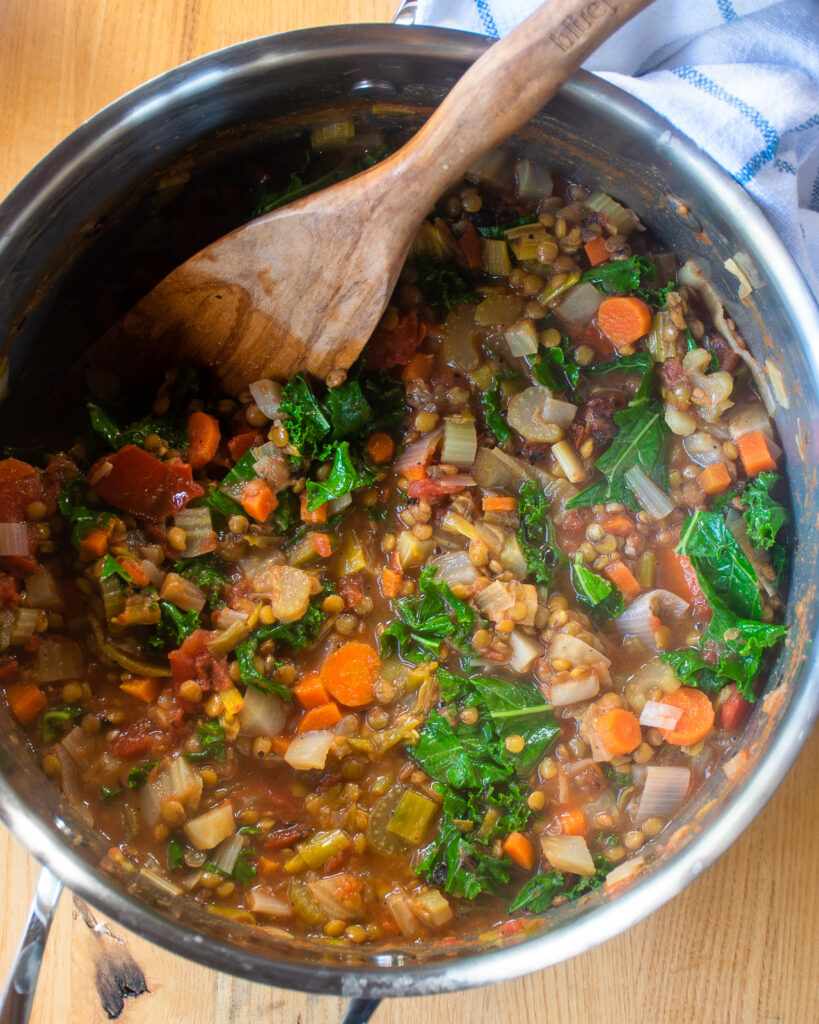 Looking down into a stockpot with lentil soup inside.