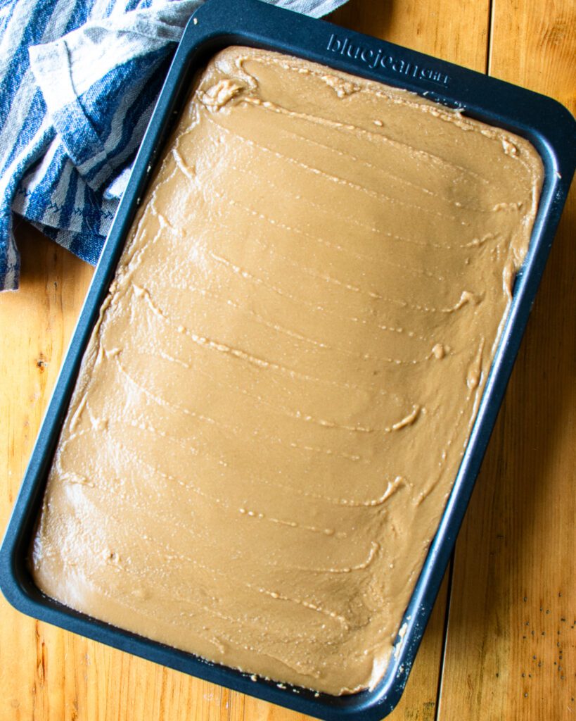 Looking down on hot milk cake, iced with brown sugar icing.